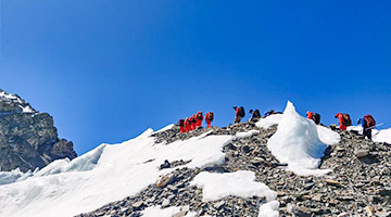 Chinese remeasuring surveyors hike toward advance camp at altitude of 6,500 meters on Mount Qomolangma
