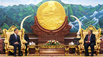 Laos, China vow to further enhance ties, cooperation 