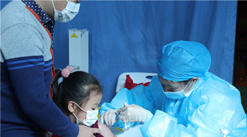Kids aged 3 to 11 receive Covid-19 vaccine shots in Kunming