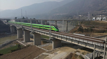 Remote Daliang Mountain in SW China sees departure of first bullet train