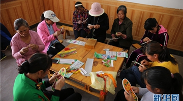 Yunnan village girl opens embroidery plants to battle poverty